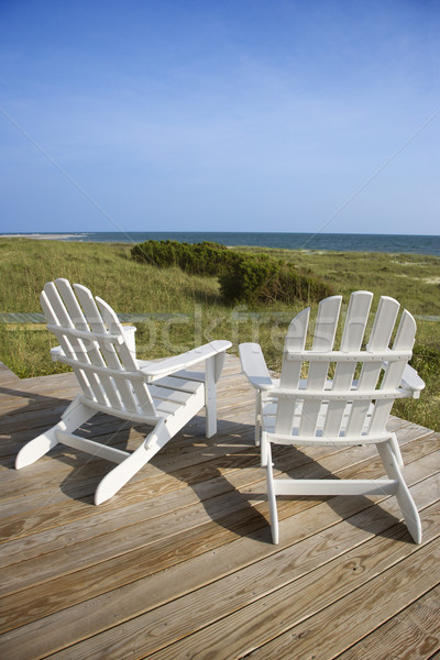 Chairs on Deck Facing Ocean Stock photo © iofoto