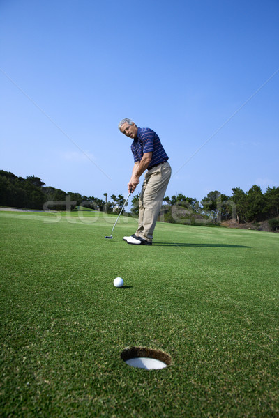Zdjęcia stock: Człowiek · gry · golf · piłeczki · do · golfa · otwór · pierwszy · plan