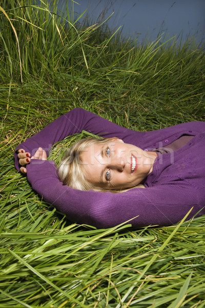 Woman lying in grass. Stock photo © iofoto