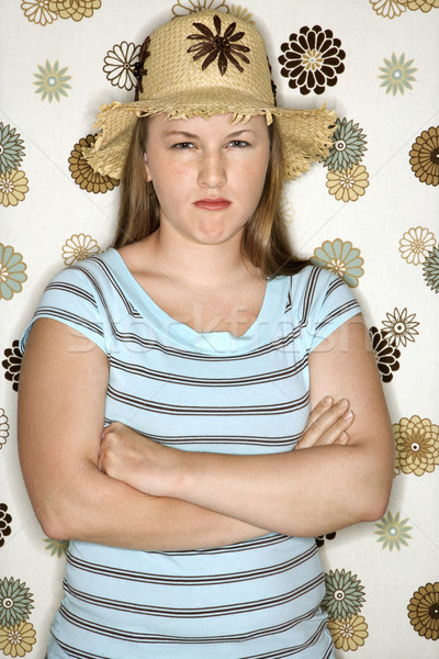 Woman pouting with arms crossed. Stock photo © iofoto