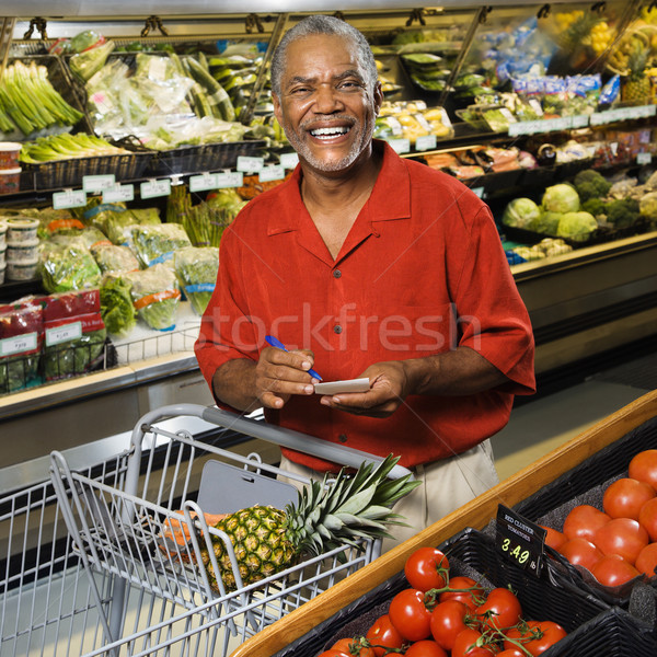 Stock photo: Man grocery shopping.