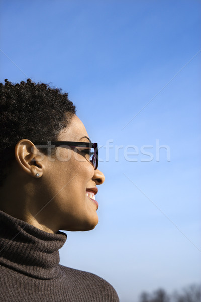 Profil mosolyog fiatal afroamerikai nő vonzó afroamerikai Stock fotó © iofoto