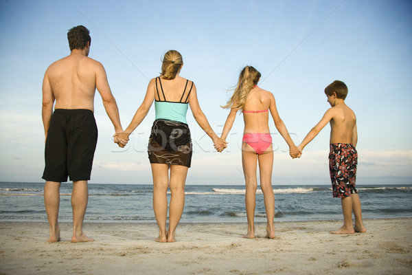 Сток-фото: семьи · пляж · вид · сзади · , · держась · за · руки · горизонтальный · выстрел