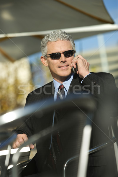 Businessman on cellphone. Stock photo © iofoto