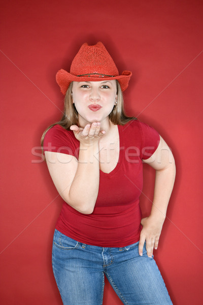 Young woman blowing kiss. Stock photo © iofoto