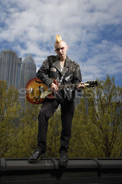 панк играет гитаре портрет кавказский мужчины Сток-фото © iofoto