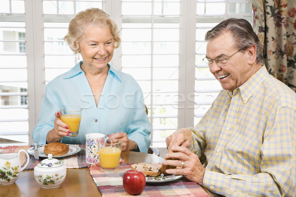 Mature couple eating breakfast. Stock photo © iofoto