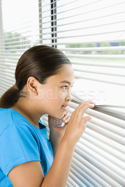 Dziewczyna patrząc na zewnątrz okno widok z boku asian Zdjęcia stock © iofoto
