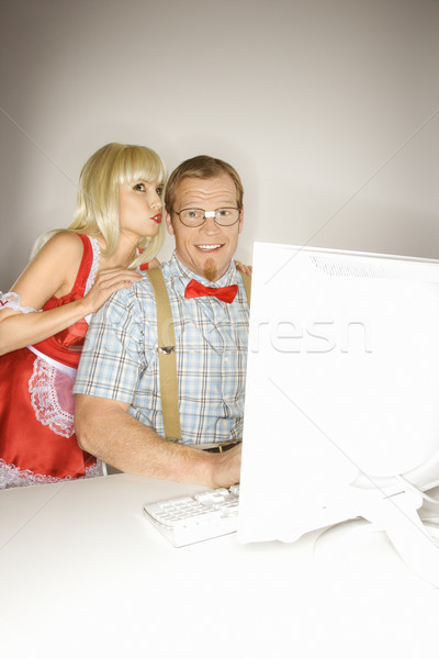 Woman flirting with nerd. Stock photo © iofoto