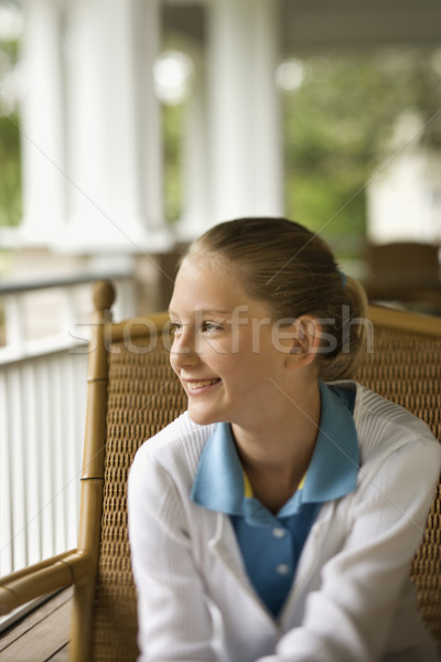 Junge Mädchen Veranda lächelnd Sitzung schauen aus Stock foto © iofoto