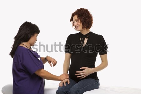 Pregnant woman and nurse. Stock photo © iofoto