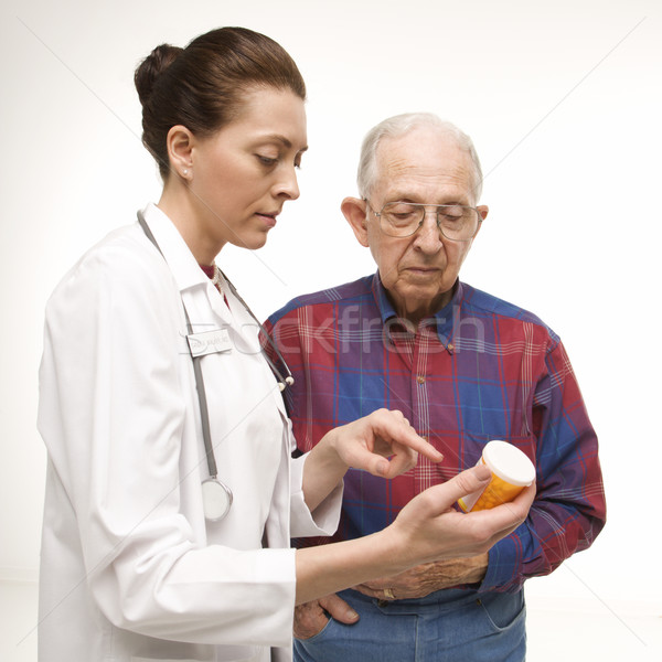 Doctor explaining medicine. Stock photo © iofoto