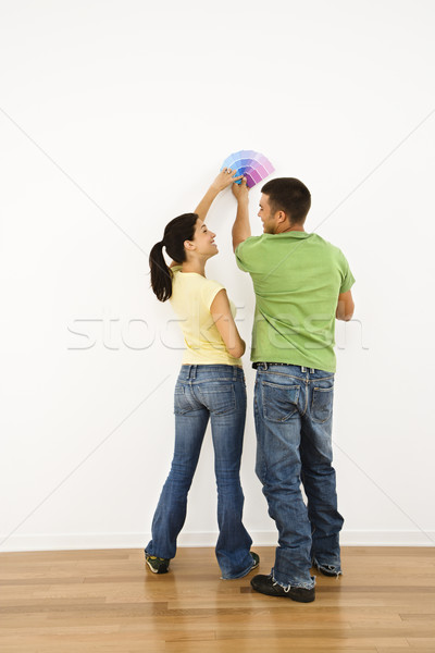 Stock photo: Couple choosing paint.