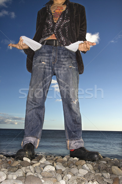 Young Man at Beach with Empty Pockets Stock photo © iofoto