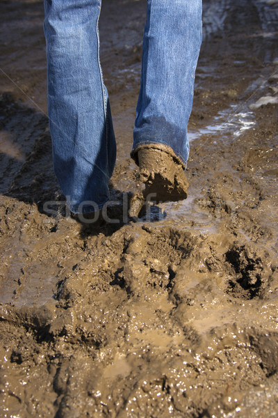 [[stock_photo]]: Jambes · marche · boue · personne