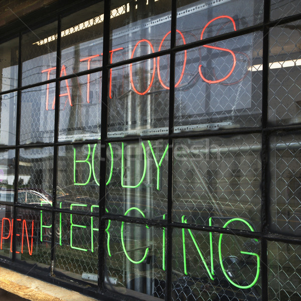 Dövme alışveriş imzalamak neon pencere Stok fotoğraf © iofoto