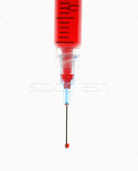 Needle with red liquid. Stock photo © iofoto