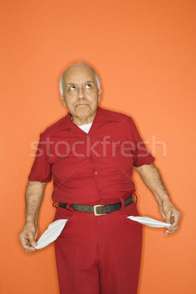 Man with empty pockets. Stock photo © iofoto