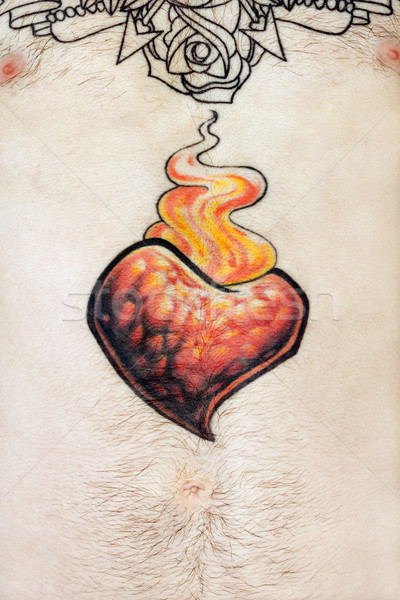 Shirtless tattooed male chest. Stock photo © iofoto