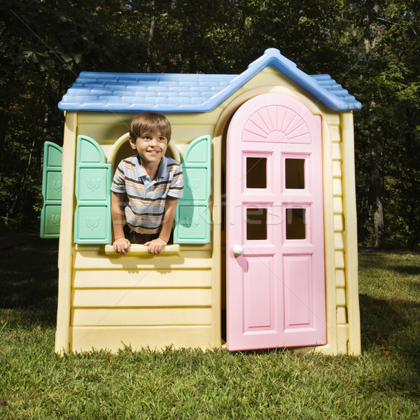 Stock photo: Boy in playhouse.