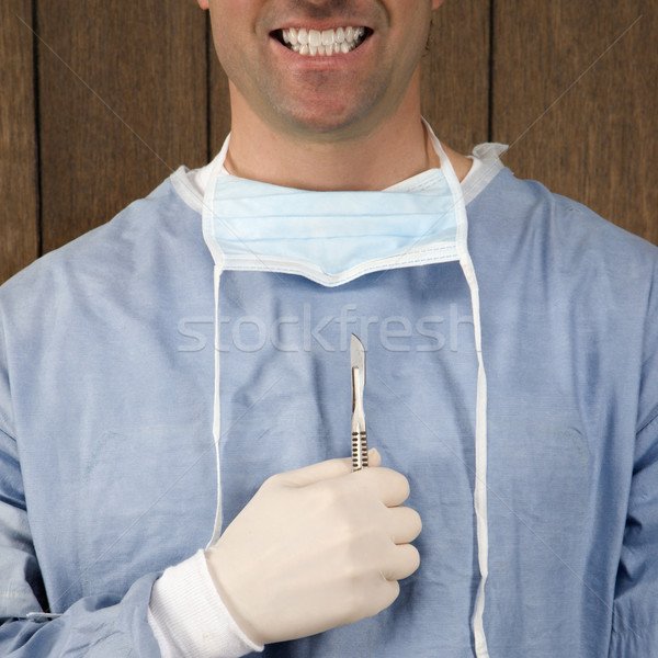 Chirurg halten Skalpell männlich lächelnd Stock foto © iofoto