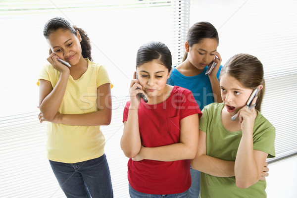 Lányok beszél mobiltelefonok lány gyerekek mobil Stock fotó © iofoto