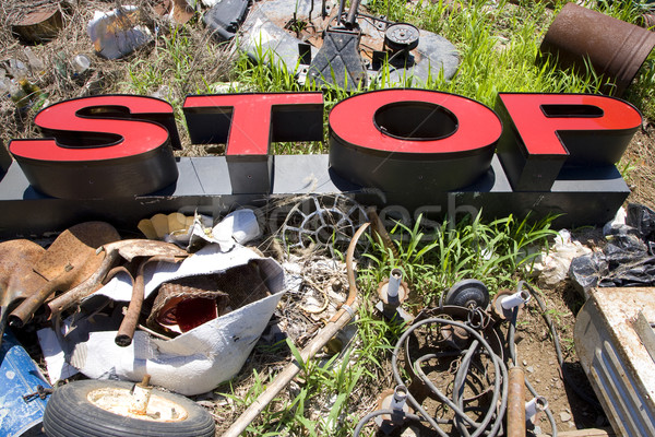 Letters spelling STOP in trashy junkyard. Stock photo © iofoto