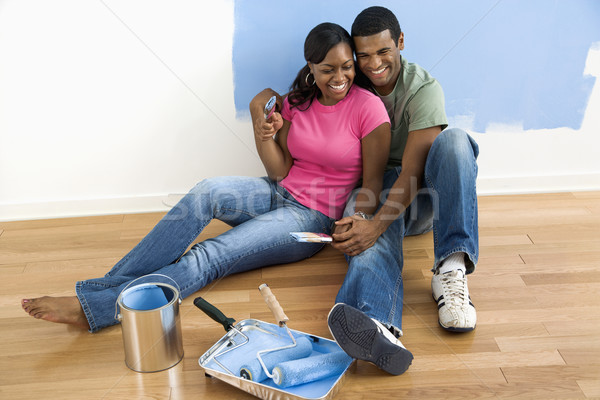 Couple relaxing on floor. Stock photo © iofoto