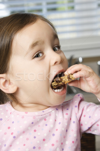 girl eating cookie. stock photo 08 iofoto