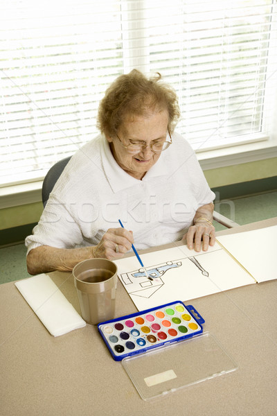 Mature woman painting. Stock photo © iofoto