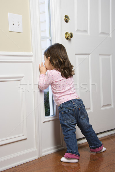 Girl at window. Stock photo © iofoto