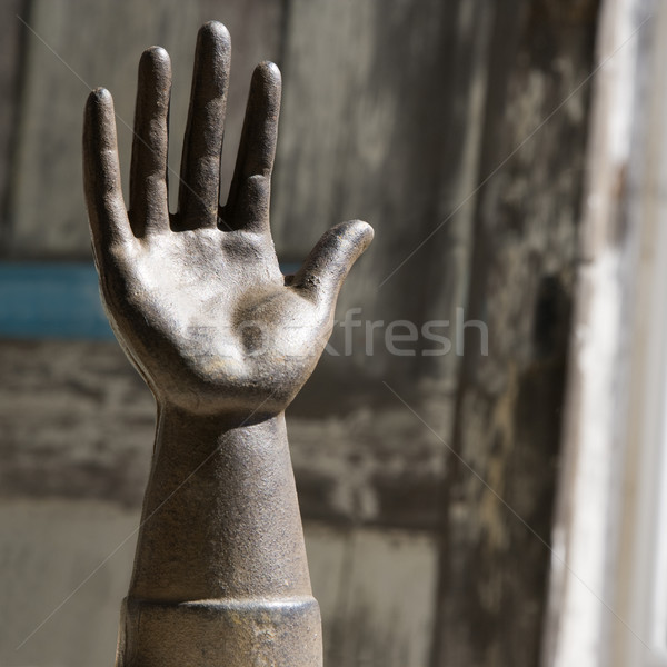 Old metal hand statuette. Stock photo © iofoto