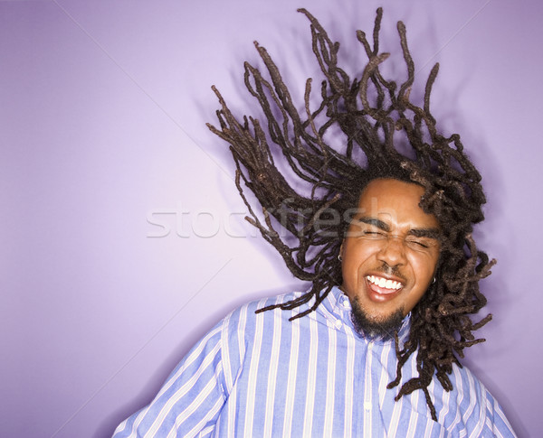 African-American man with his dreadlocks in motion. Stock photo © iofoto