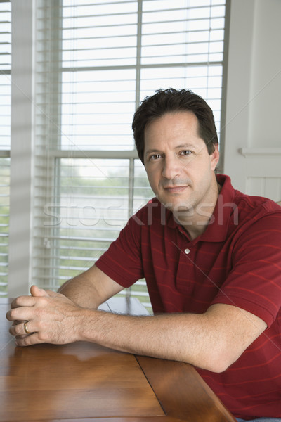 Homme séance table portrait regarder [[stock_photo]] © iofoto