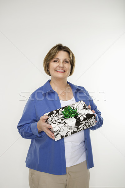 Woman holding gift. Stock photo © iofoto