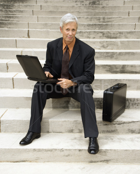Geschäftsmann Porträt Sitzung Schritte Stock foto © iofoto