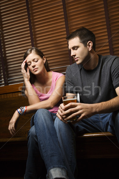 Para patrząc niewygodny zdenerwowany posiedzenia publikacji Zdjęcia stock © iofoto