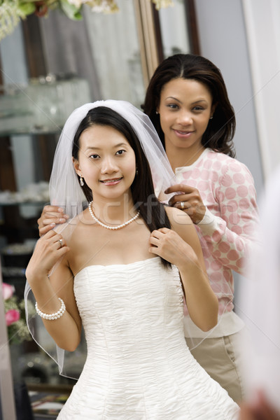 Stock photo: Friend helping bride.