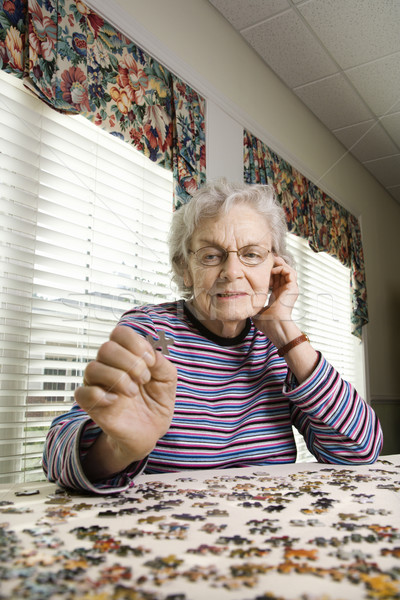 Elderly Woman Doing Jig Saw Puzzle Stock photo © iofoto