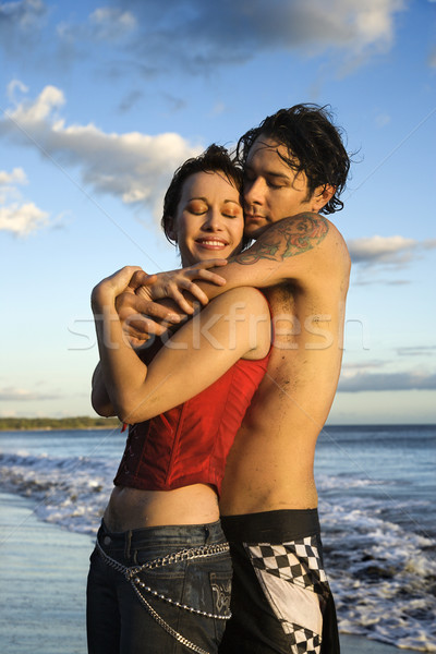 Couple embracing on beach. Stock photo © iofoto