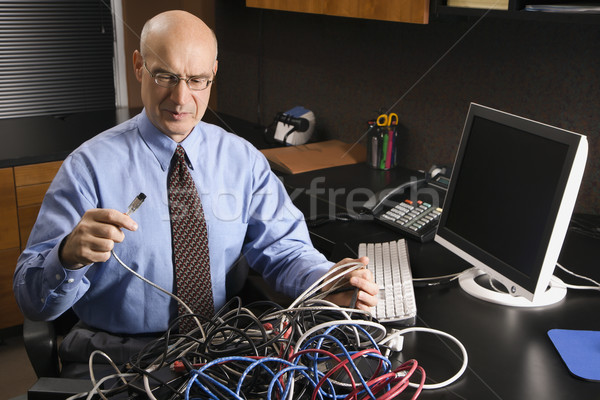Businessman with computer. Stock photo © iofoto