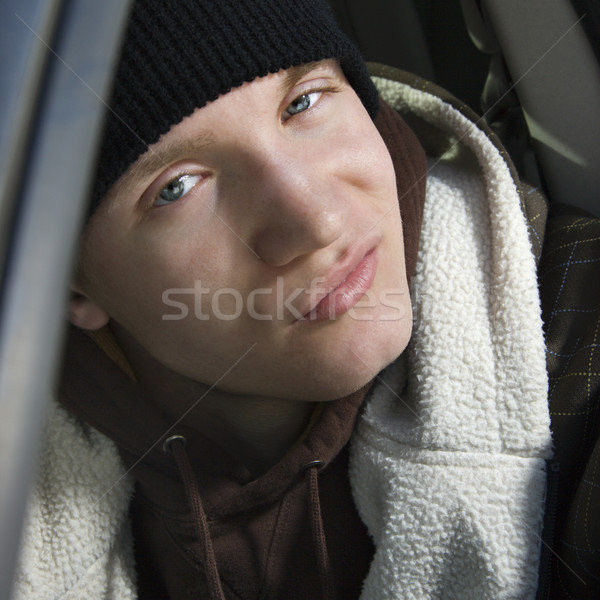 Teen with smirky expression. Stock photo © iofoto