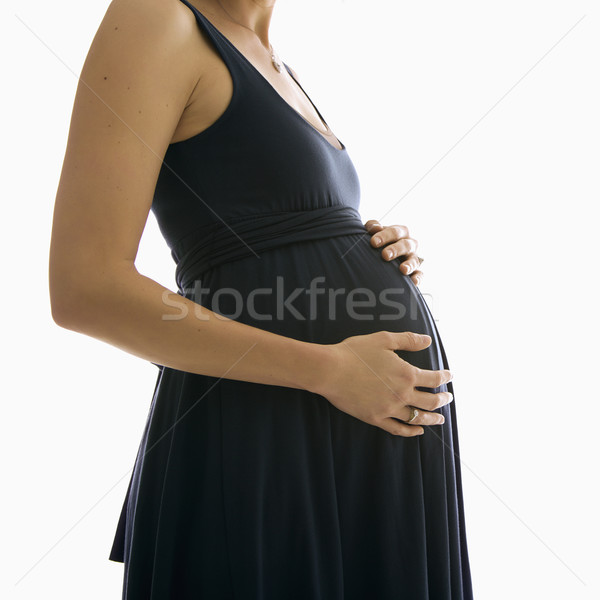 Woman holding pregnant belly. Stock photo © iofoto