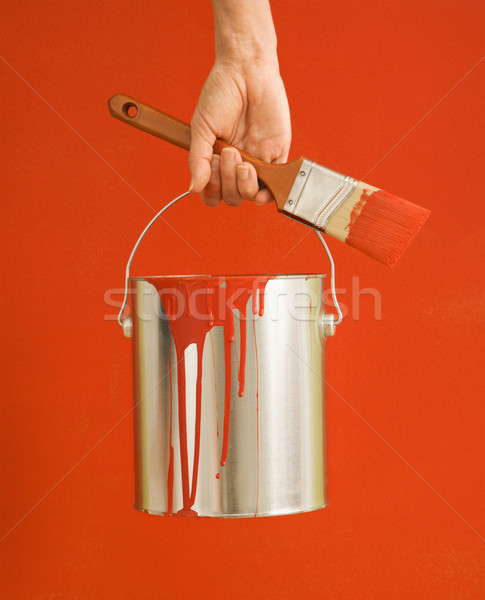 Woman holding paint can. Stock photo © iofoto