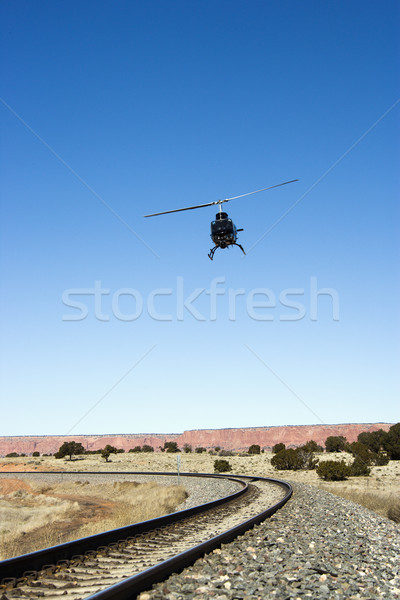 Helicopter following railroad tracks. Stock photo © iofoto