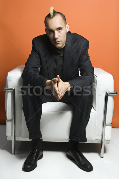 Man with mohawk wearing suit. Stock photo © iofoto