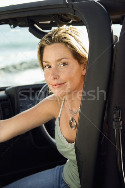 Lächelnde Frau Sitzung Auto Porträt jungen Stock foto © iofoto