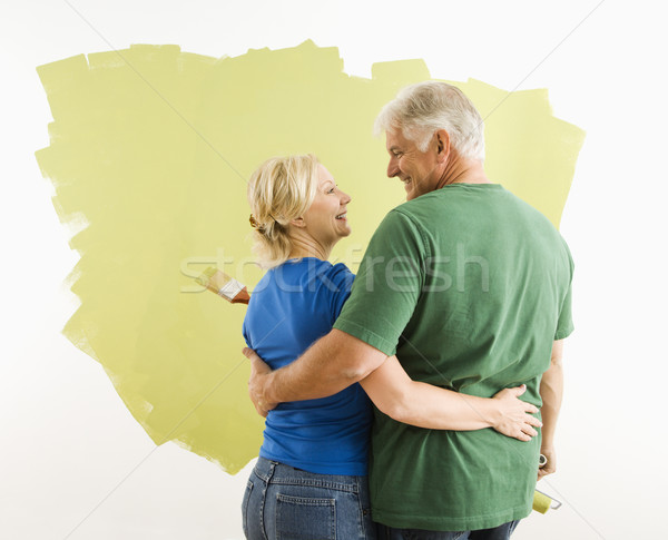 Man and woman discussing paint job. Stock photo © iofoto