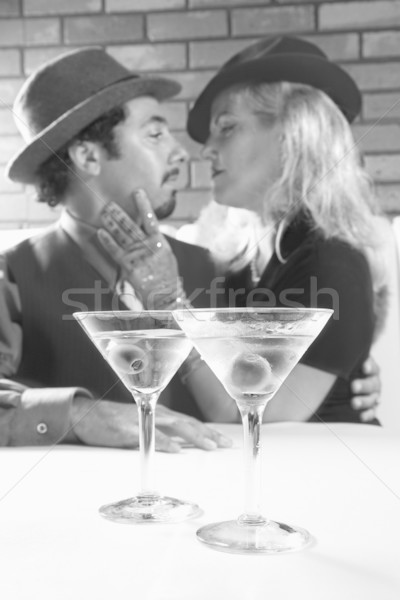 Retro couple with martinis. Stock photo © iofoto
