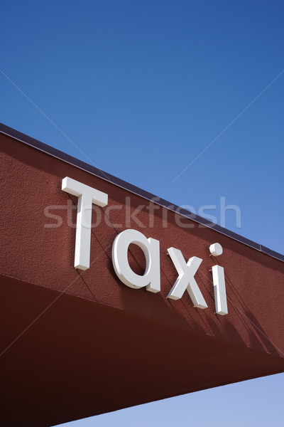 Taxi felirat barna fal tető homlokzat Stock fotó © iofoto